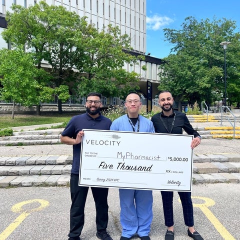 Winning MyPharmacist team holds large checque for 5 thousand dollars