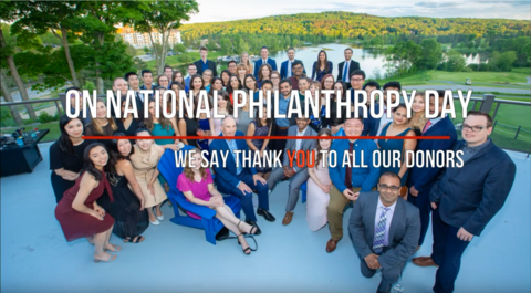 On national philanthropy day we say thank you to all our donors. Group of smiling students at conference. 