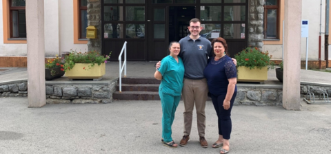 Nikola in front of a hospital in Croatia with his pharmacy mentors