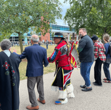 Indigenous event, people holding hands