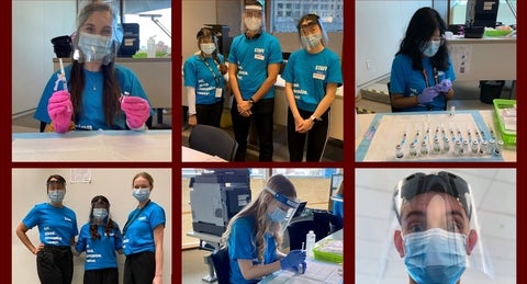 students in different roles wearing PPE while working at clinic