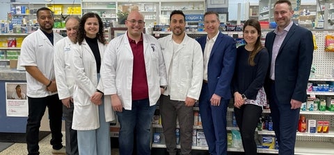 A group of people in a pharmacy