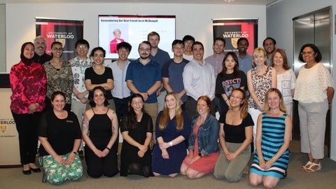 A group of students and faculty smiling