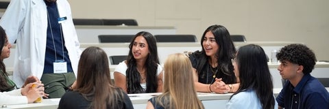 Students smiling in discussion
