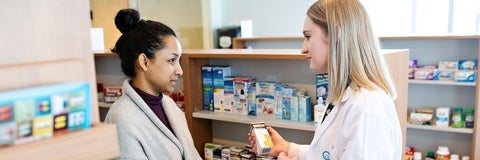 Two women in conversation about a medication