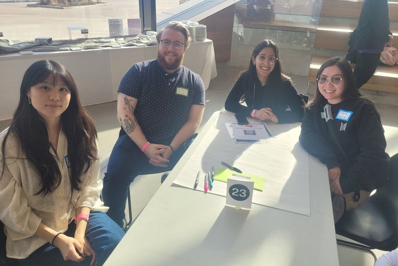 A group of students sitting around a table