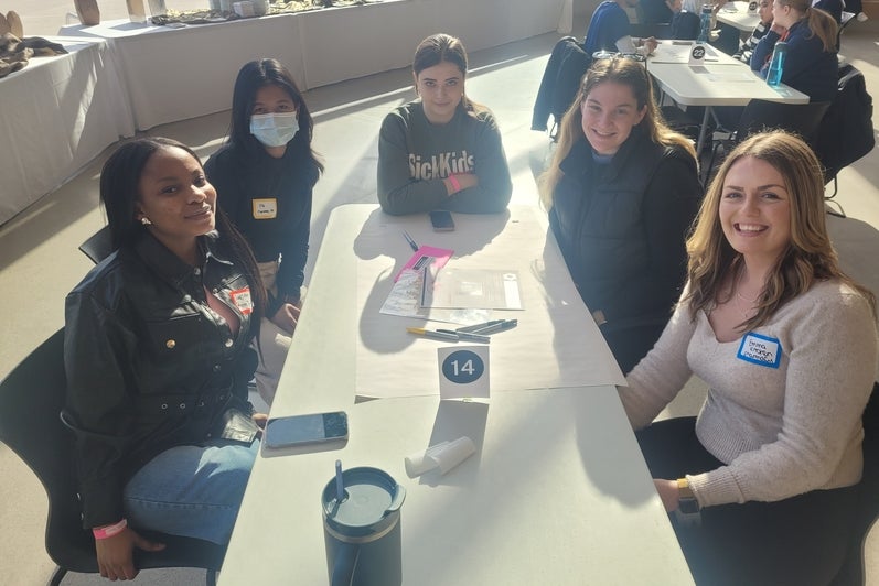 A group of students sitting around a table