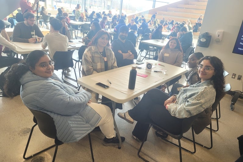 A group of students sitting around a table