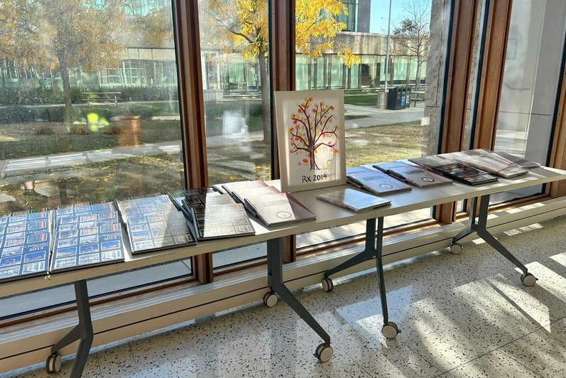 A table with books on them and a painting