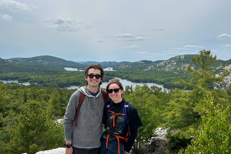 Matthew and Mackenzie smiling on a hike