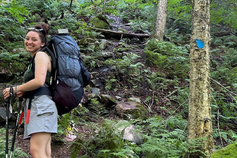 Mackenzie Gowlett hiking with a backpack
