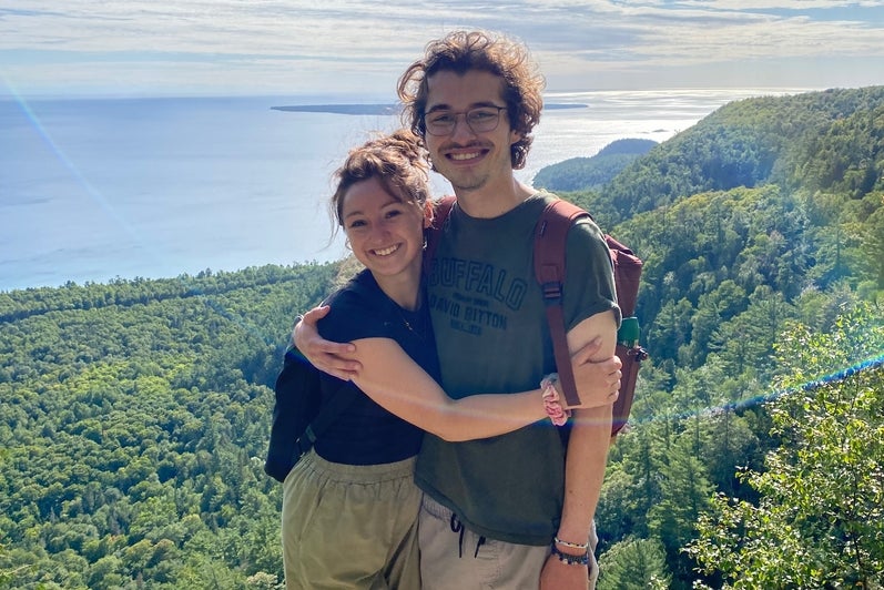 Mackenzie Gowlett and Matthew Miller smiling on a hike