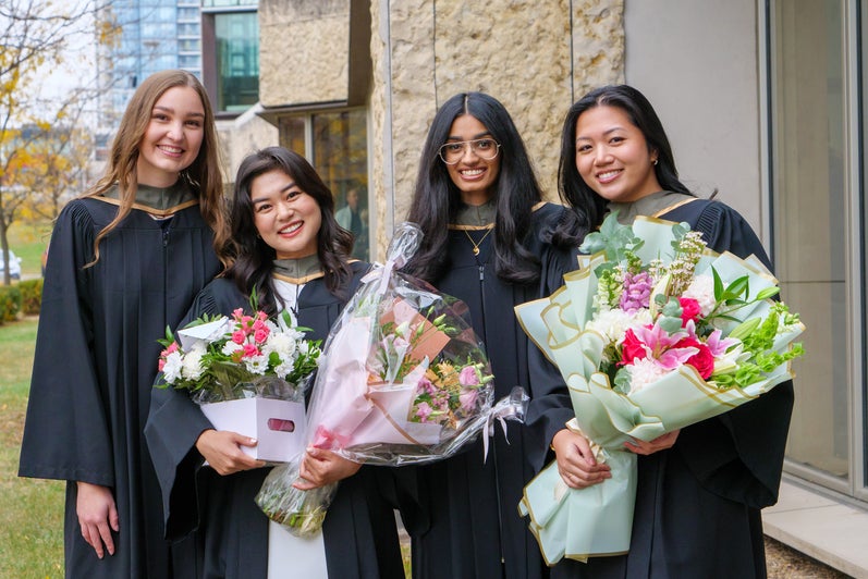 A group of graduates smiling