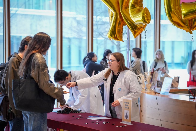 Students handing out welcome packages to new students