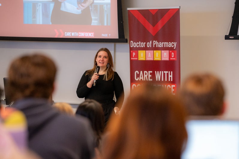 Savannah Sloat speaking at the front of a classroom