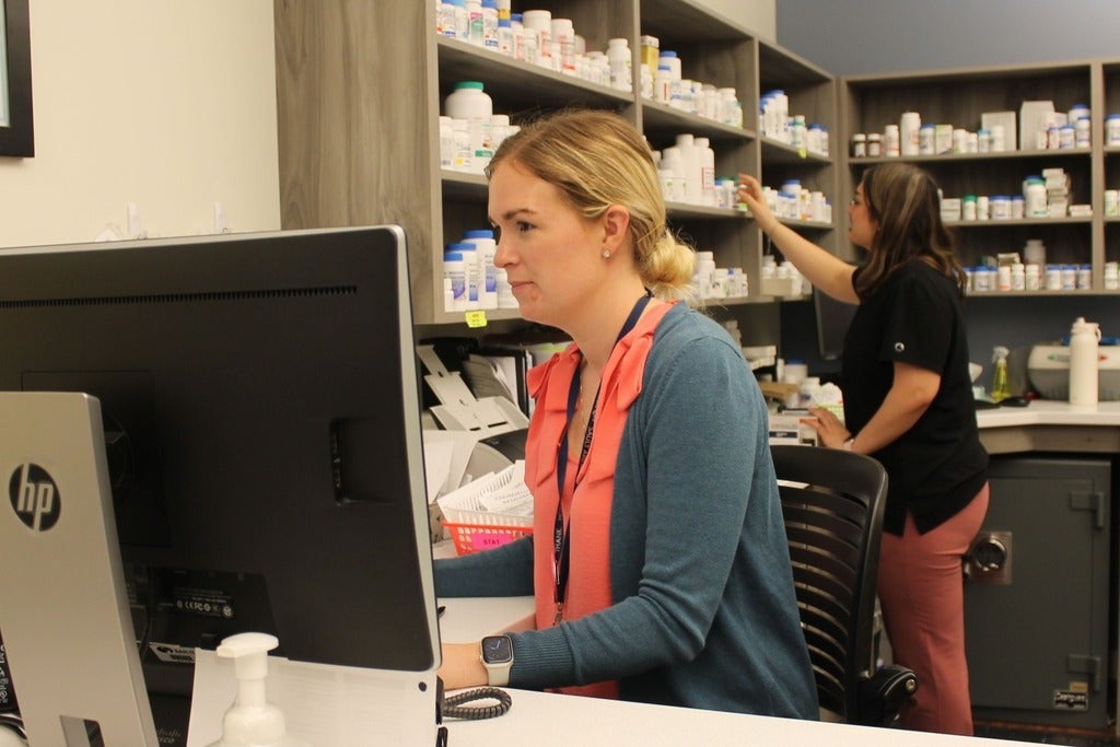 Two people working in a pharmacy