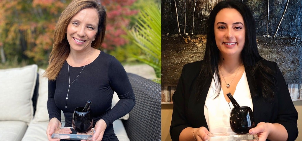 Ginette and Melissa holding their awards