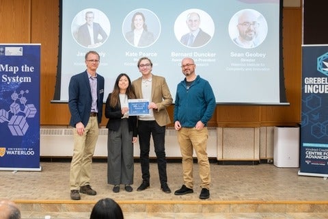 Two students receiving an award