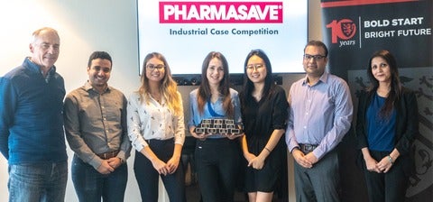 Winners of the Pharmasave Industrial Case Comeptition smiling with trophy, Dave Edwards and Jaspreet Dhaliwall.