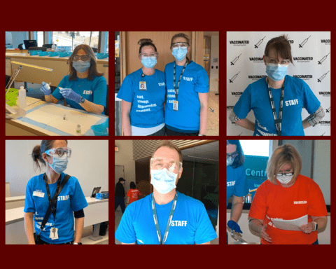 Members of the clinic team wearing staff and volunteer shirts and PPE