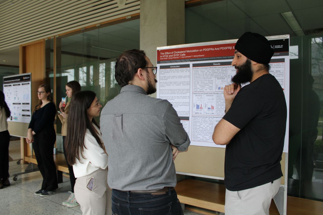 Grad students with a research board