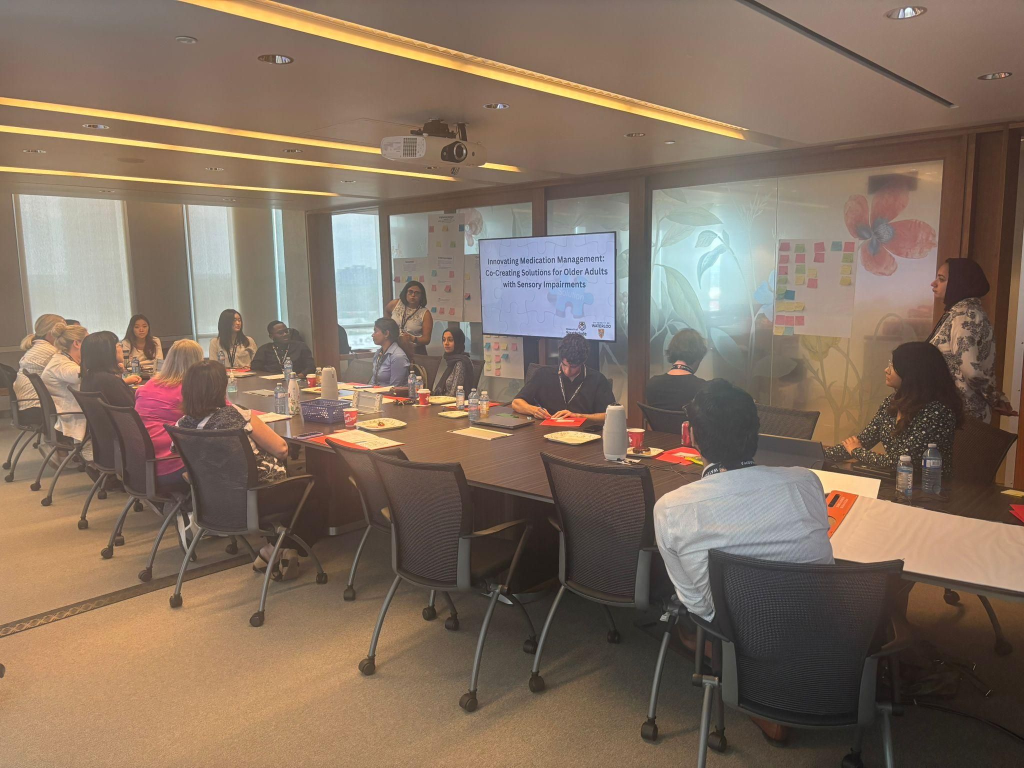 A group of people in a room in discussions