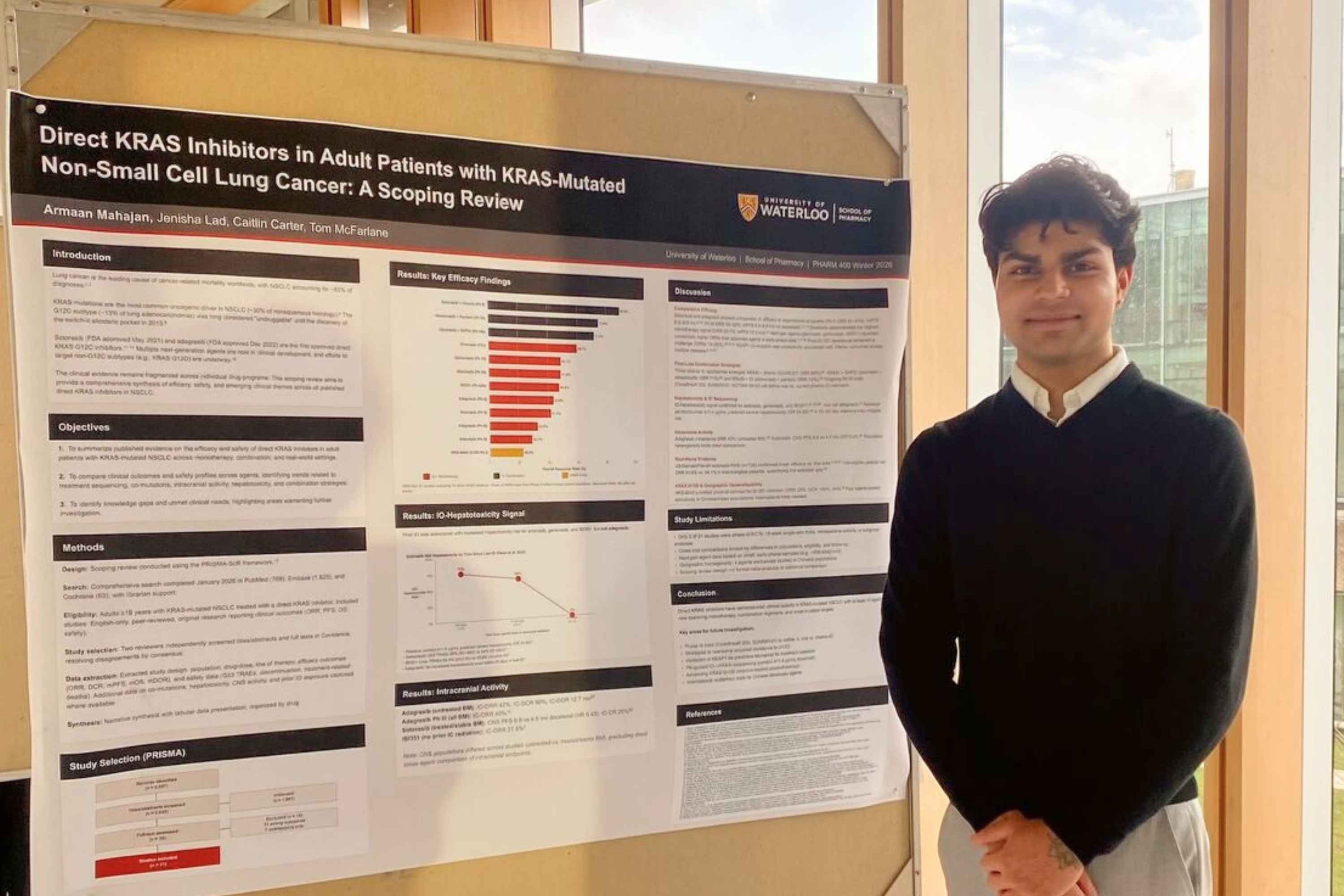 Armaan Mahajan standing in front of his scientific poster