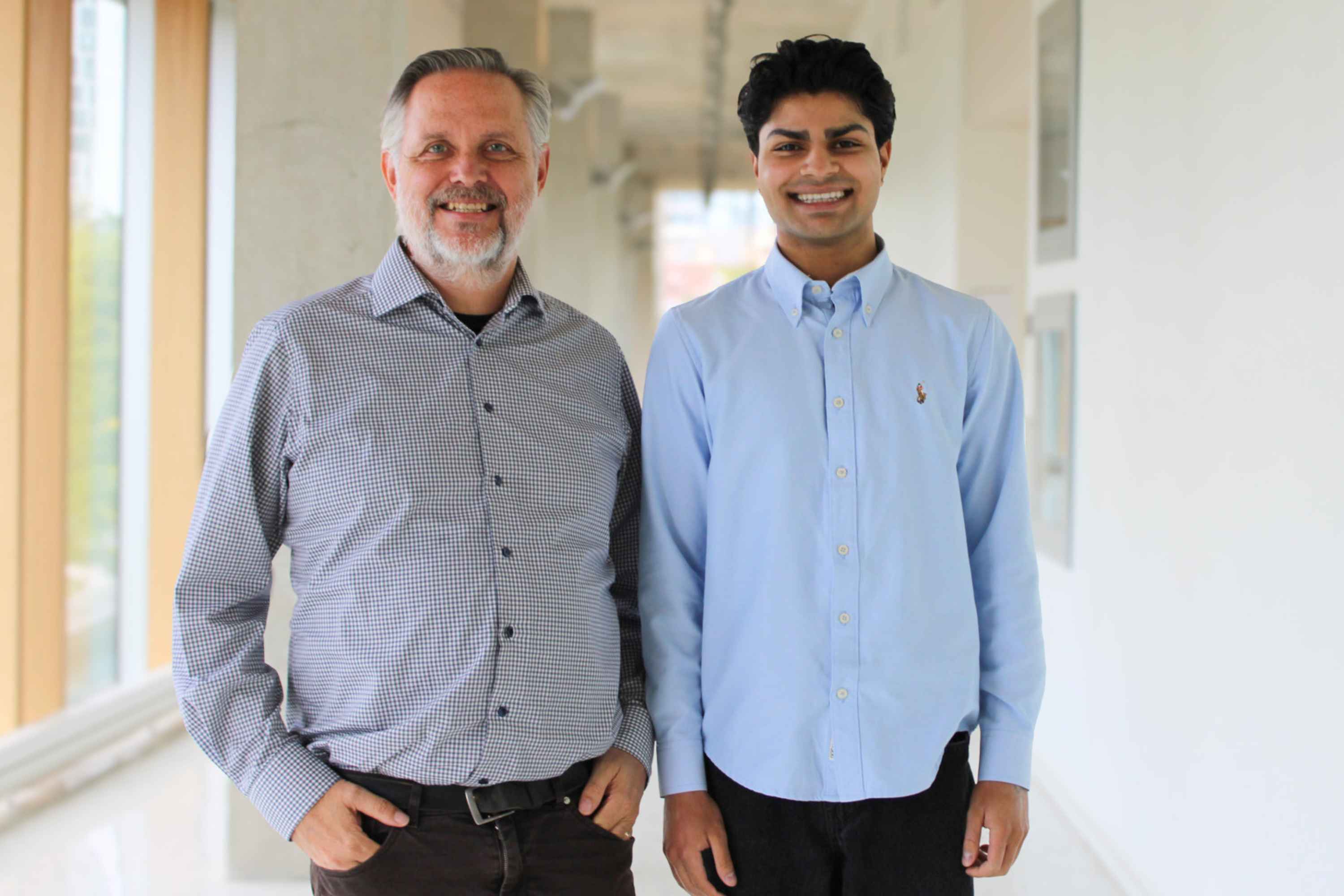 Dr. Tom McFarlane and Armaan Mahajan smiling 