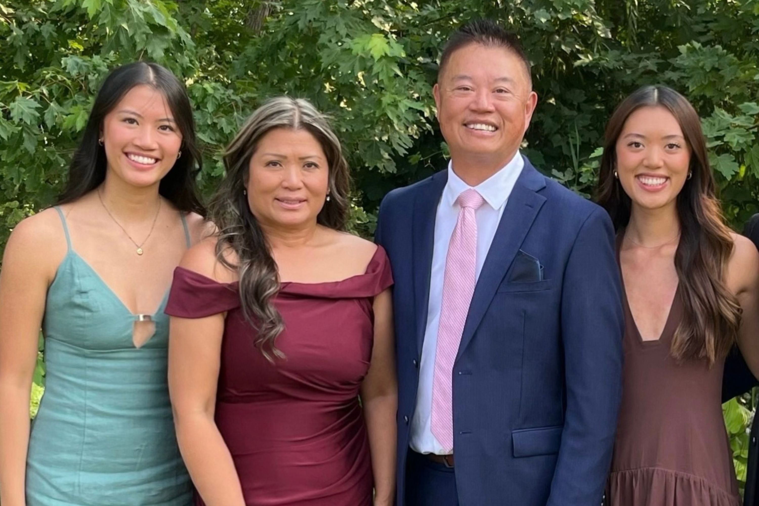 People smiling in a family photo