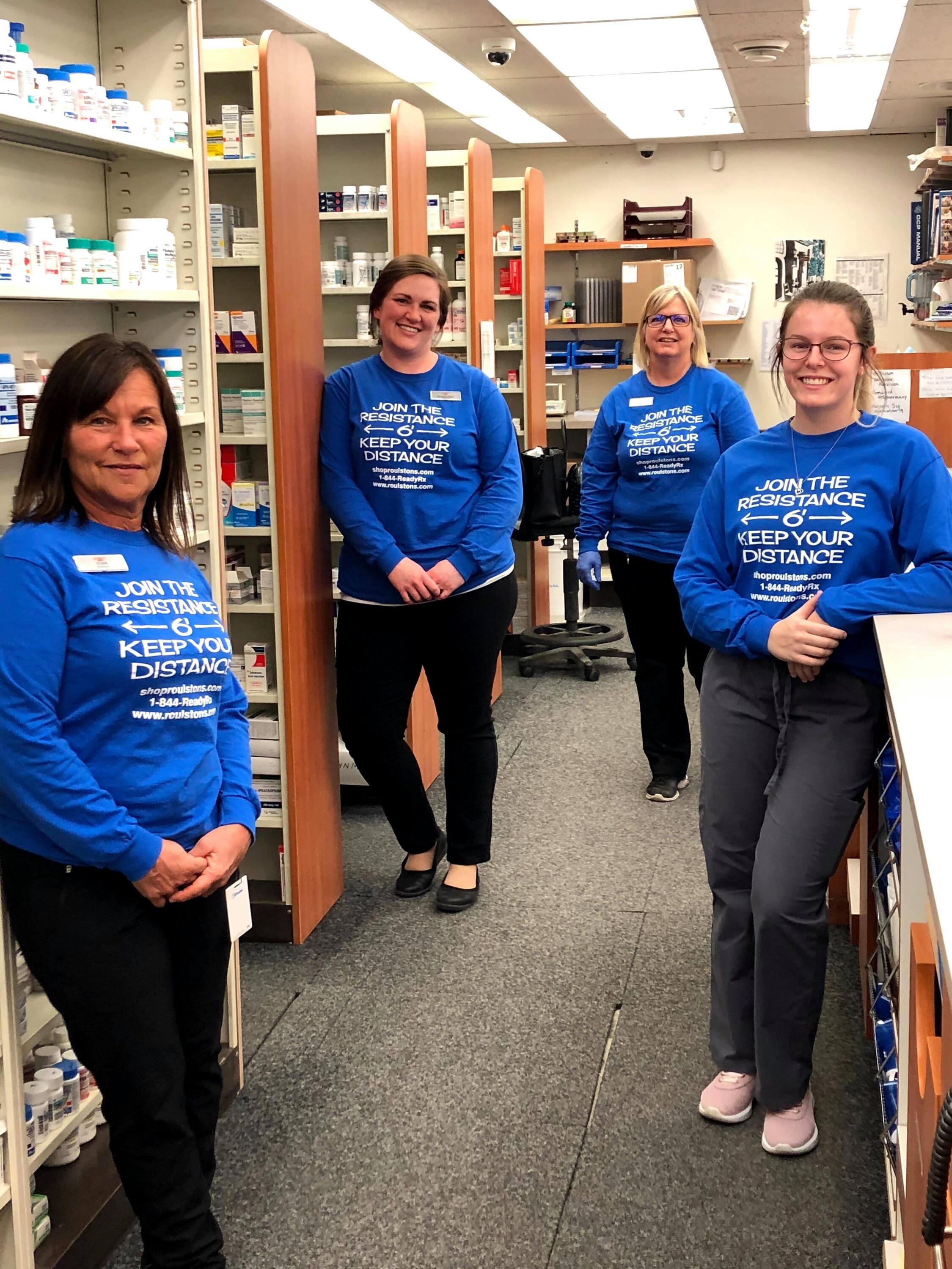 Allison and colleagues standing in the pharmacy