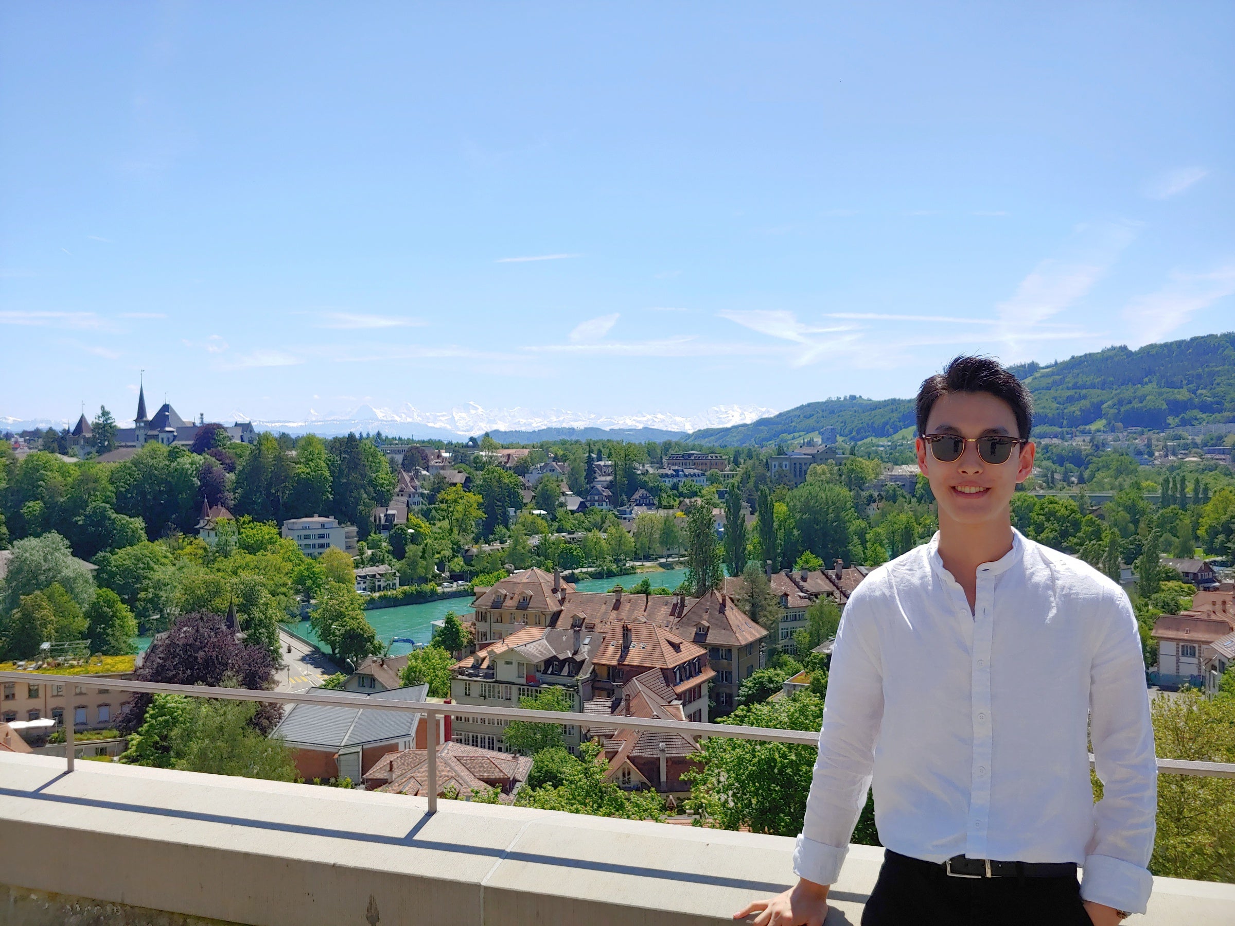 John standing on a balcony overlooking the city of Bern