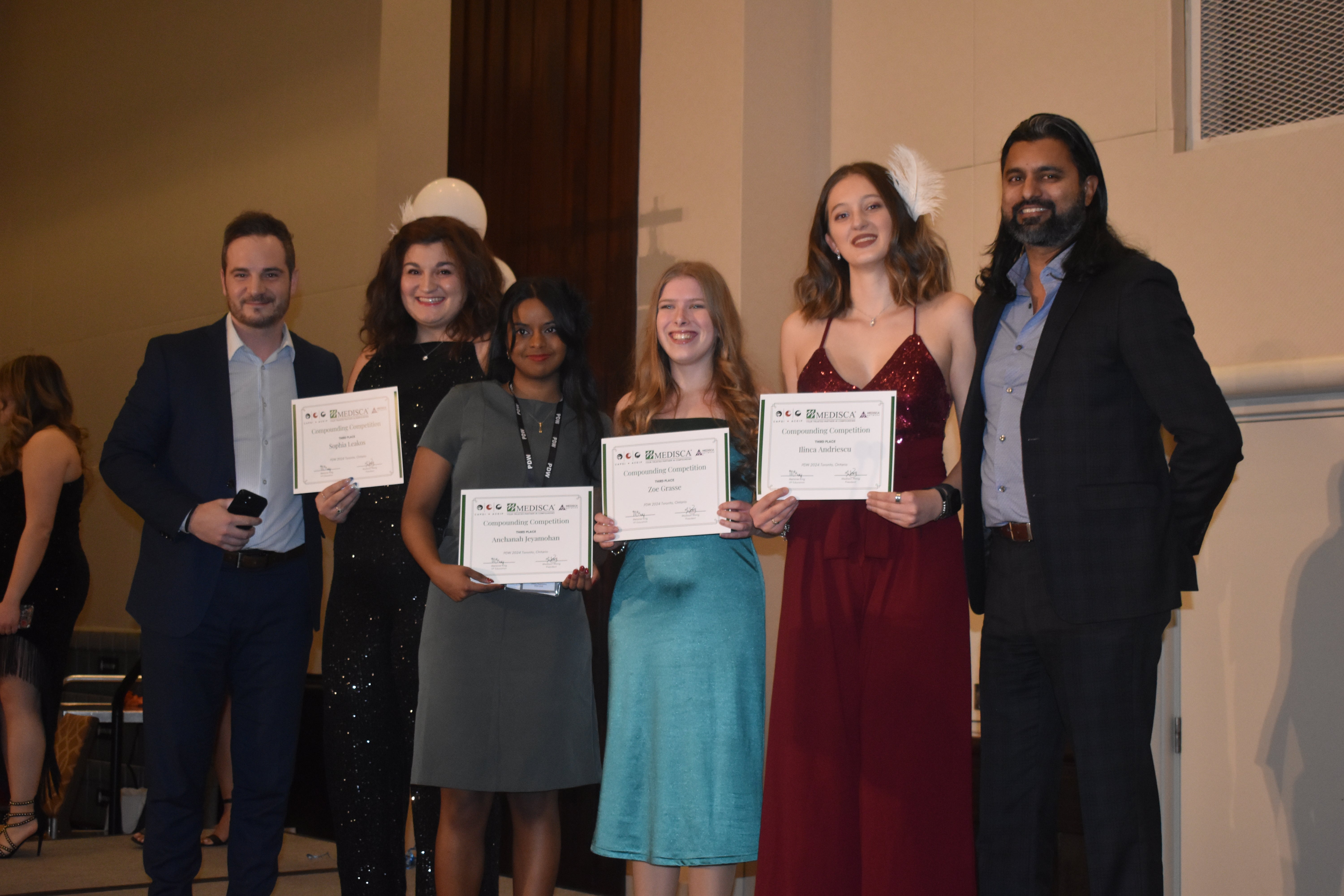 Winners of the compoundng competition posing with their certificates