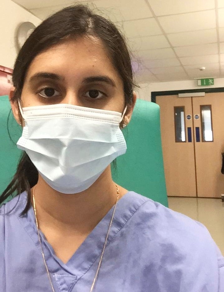 Fatimah wearing a mask in the hospital