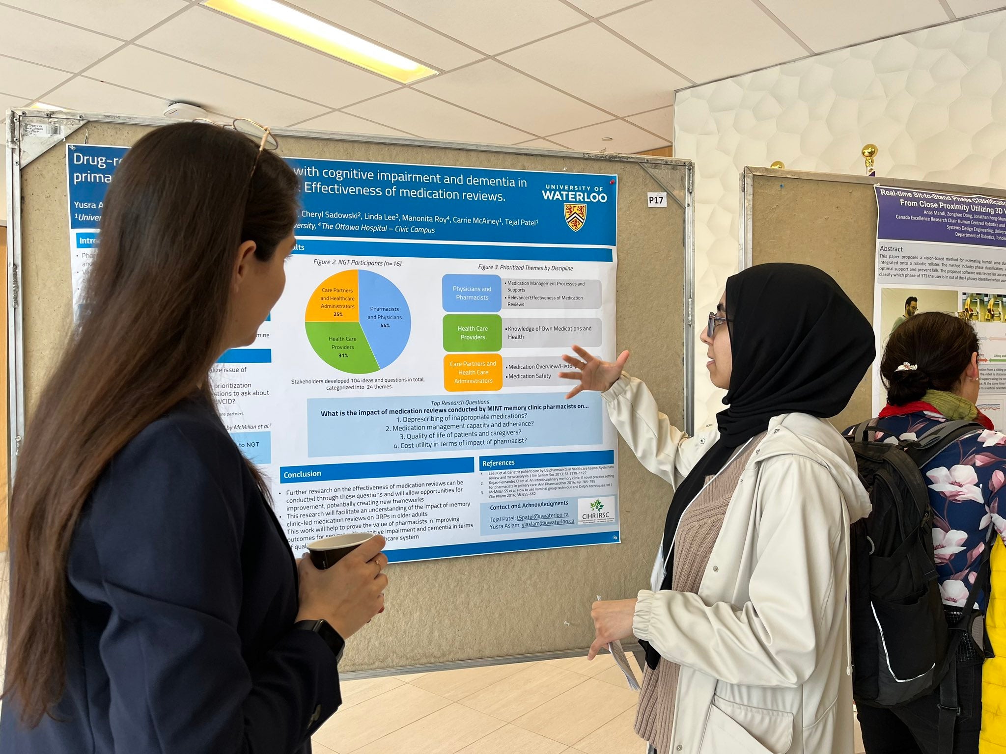 A graduate student explaining their research project