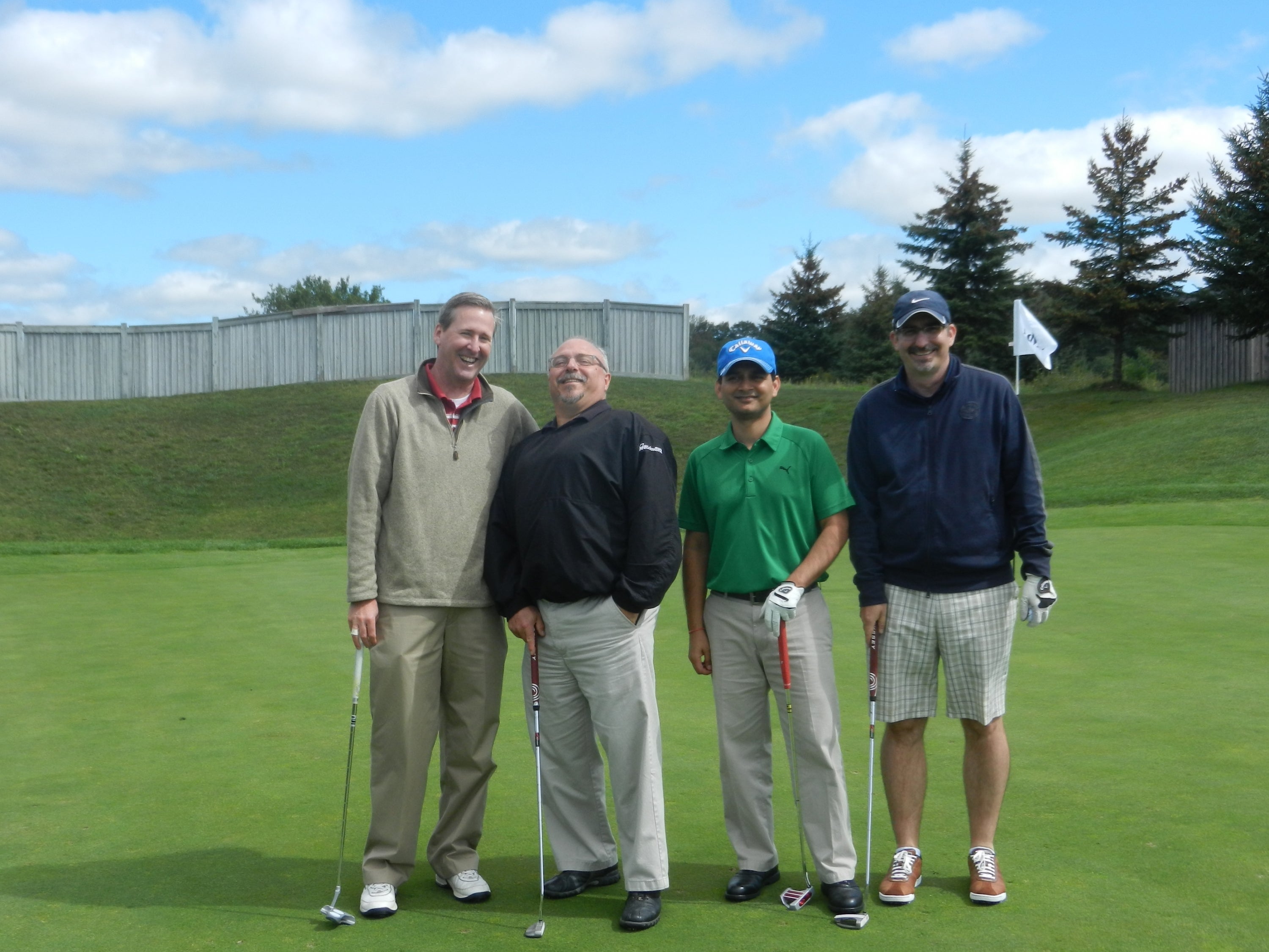 four men on golf course