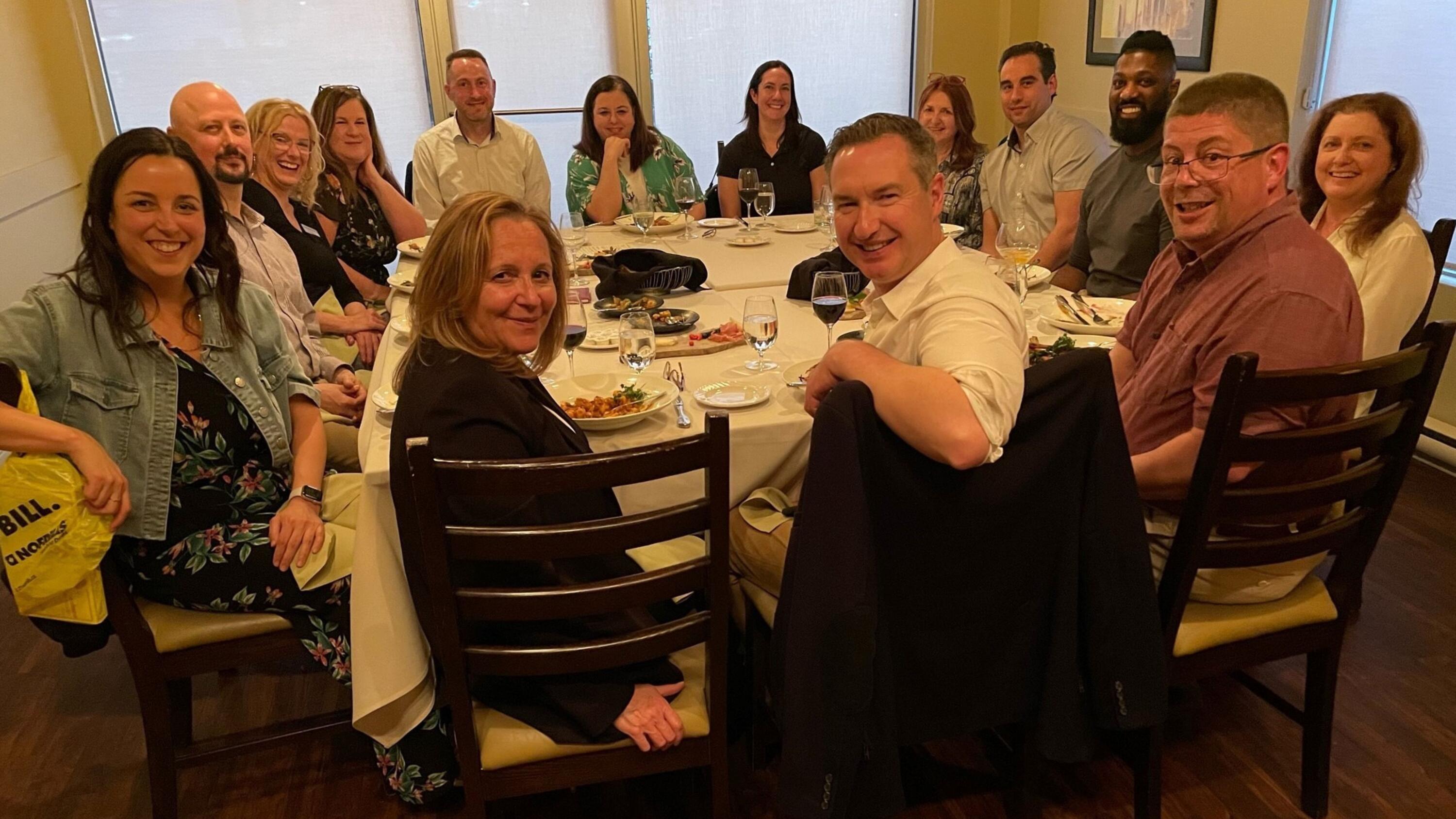 A group of people at a round dinner table