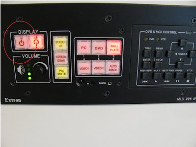 A photo of the wall plate. The left hand display panel controls the power, while the centre panel controls whether a laptop or in-built PC is used. 