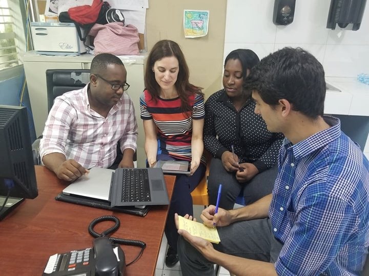 Olivier Millette in discussion with coworkers at the hospital in Haiti