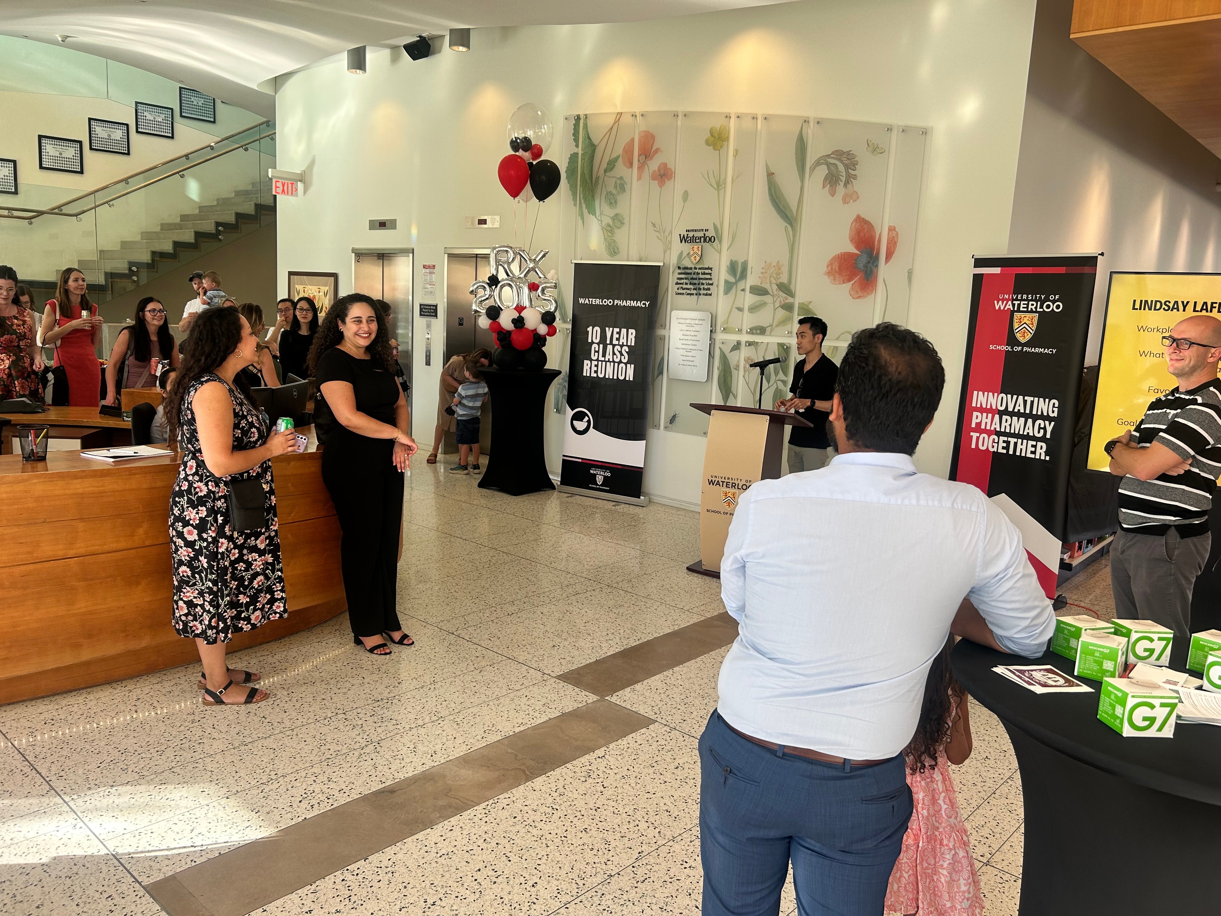People in conversation in a lobby