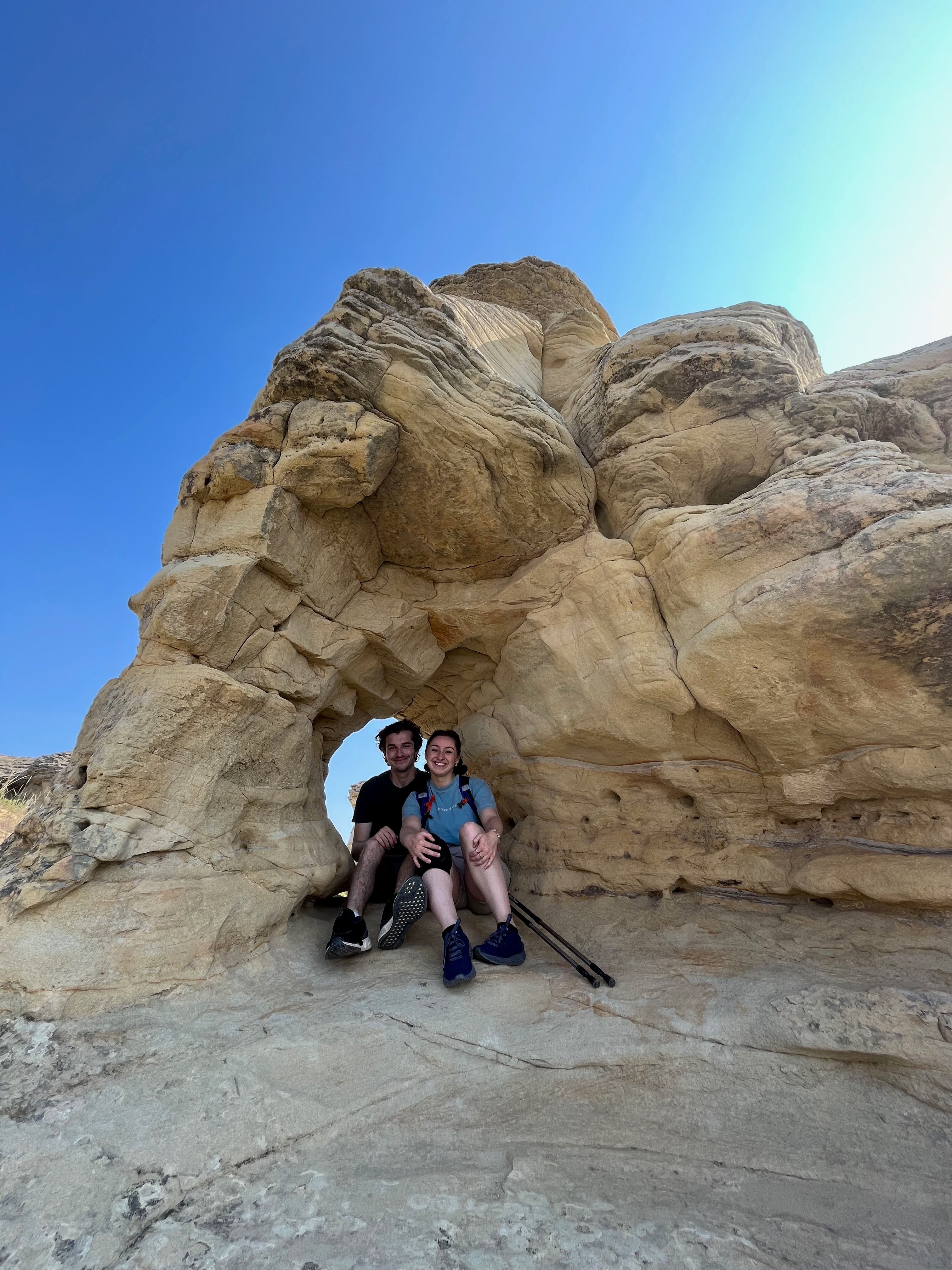 Matthew and Mackenzie smiling at Writing on Stone Provincial Park, Alberta 