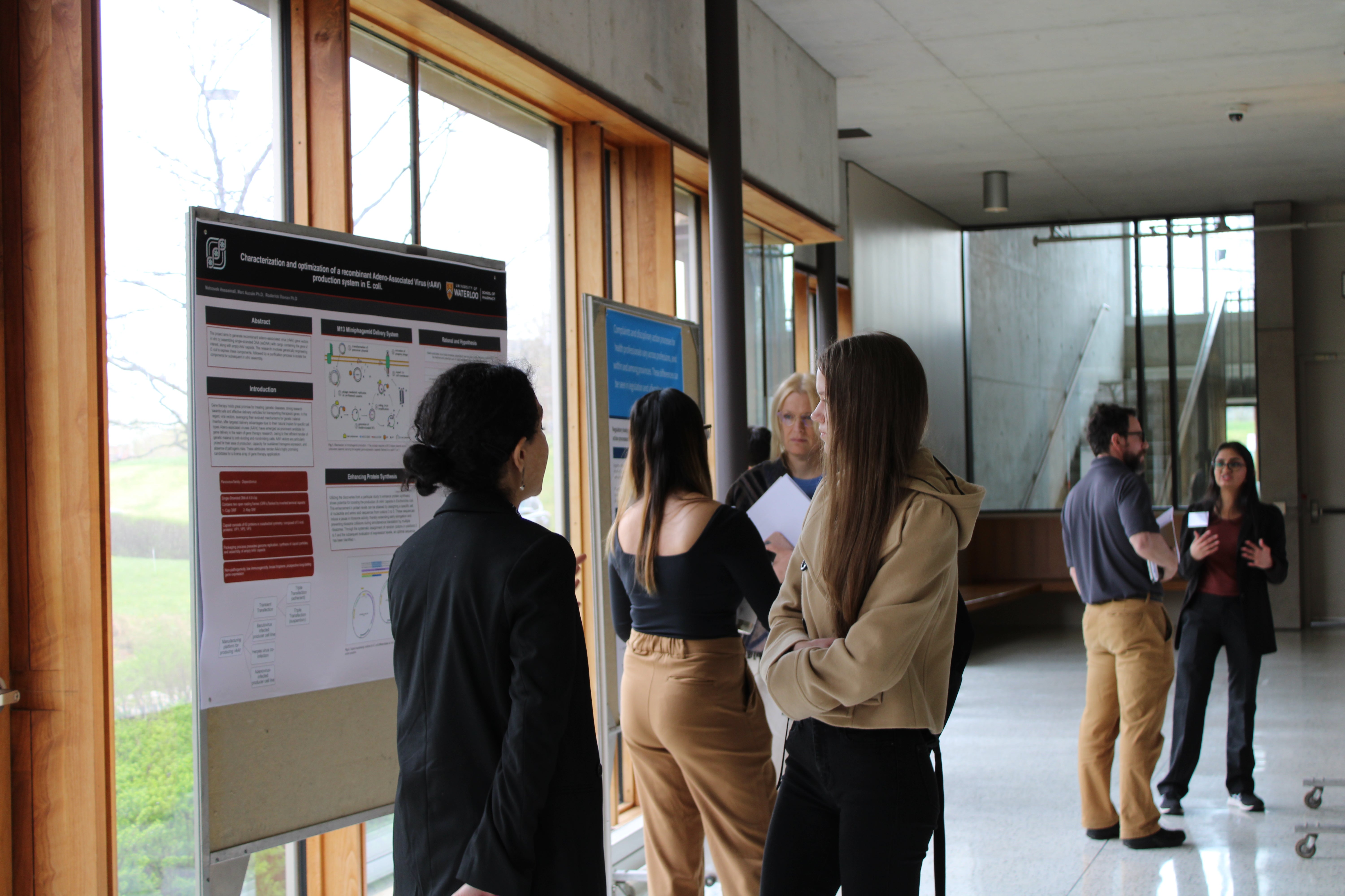 People standing in front of research posters