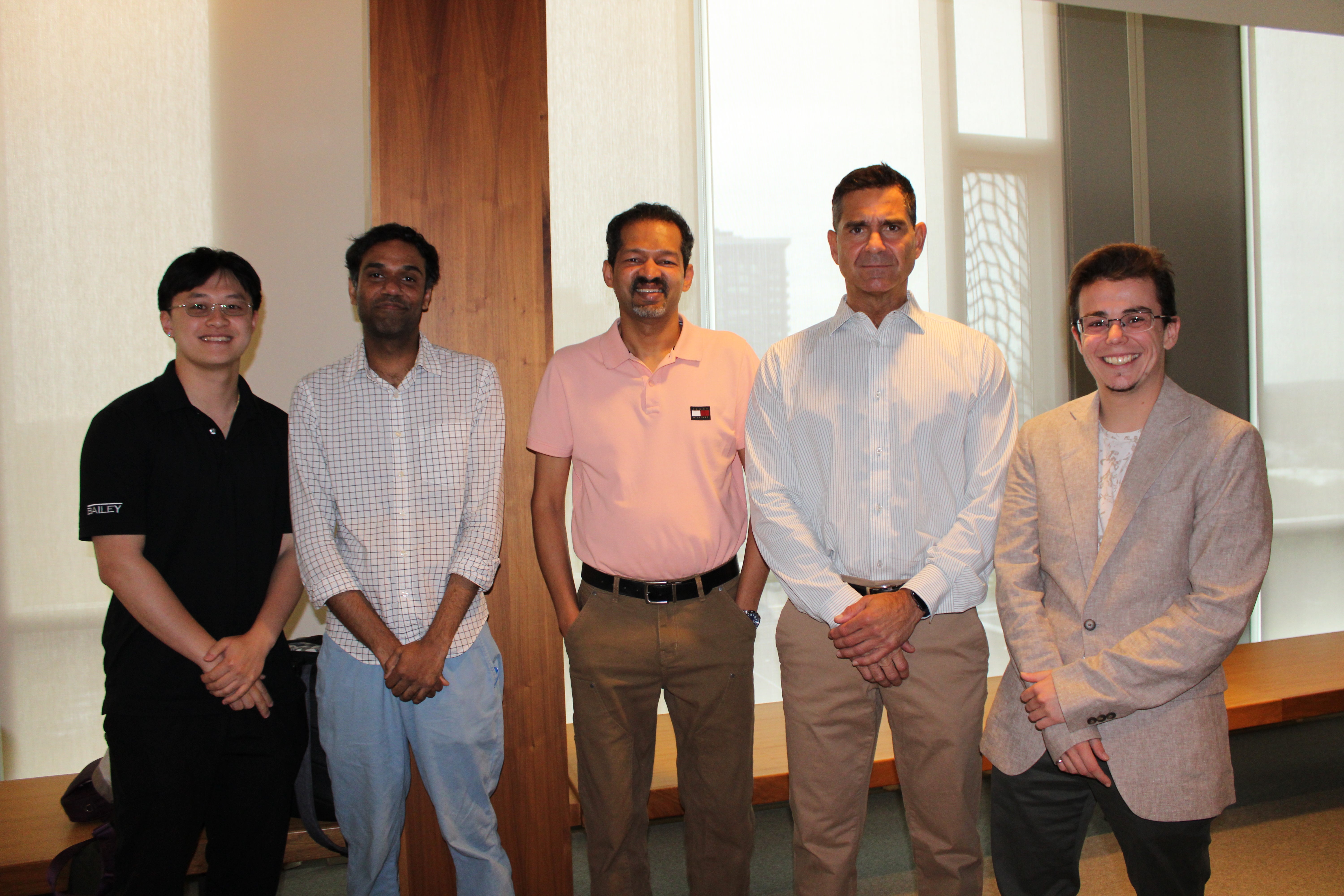 A group of men smiling