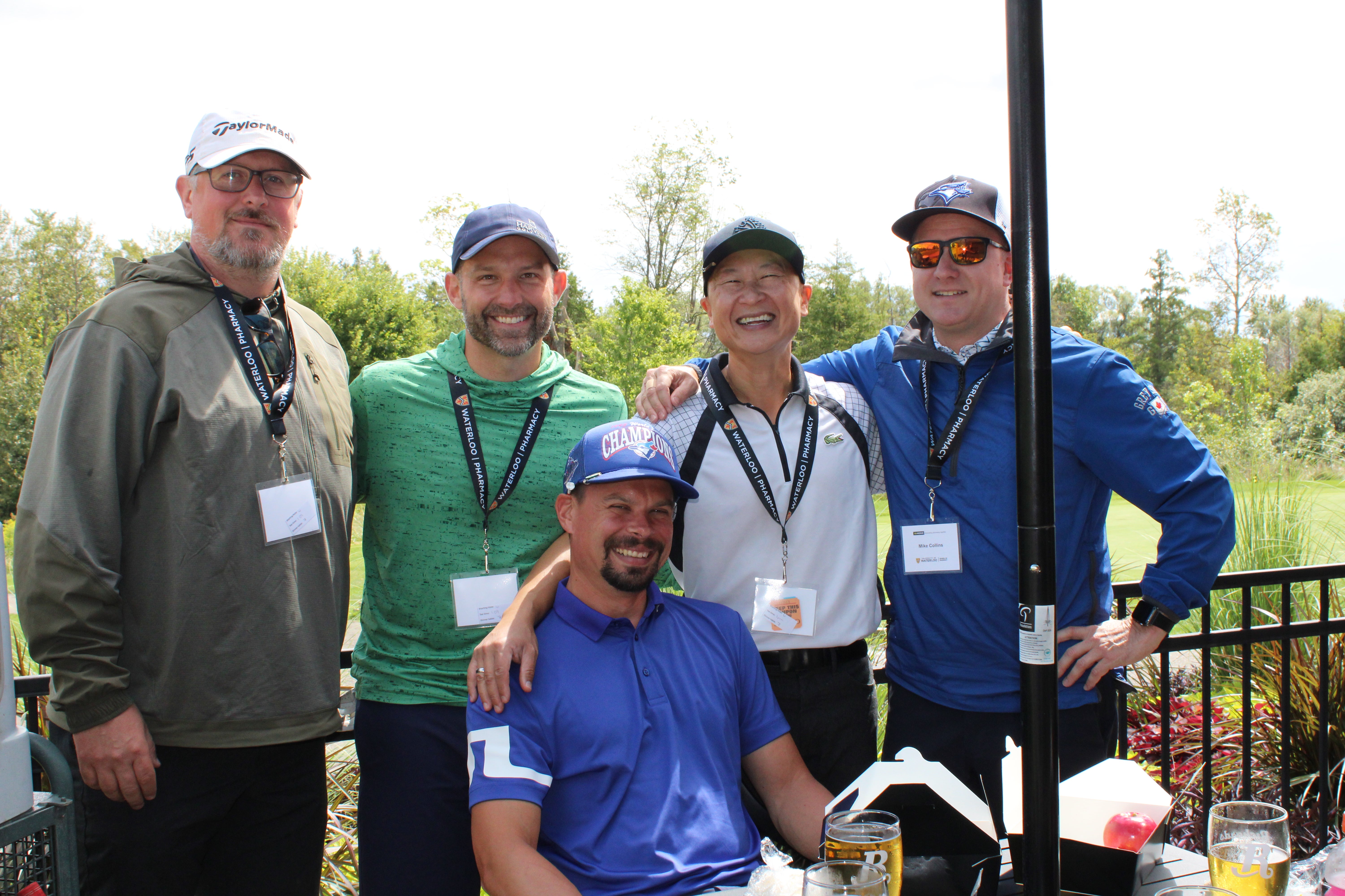 A group of men smiling