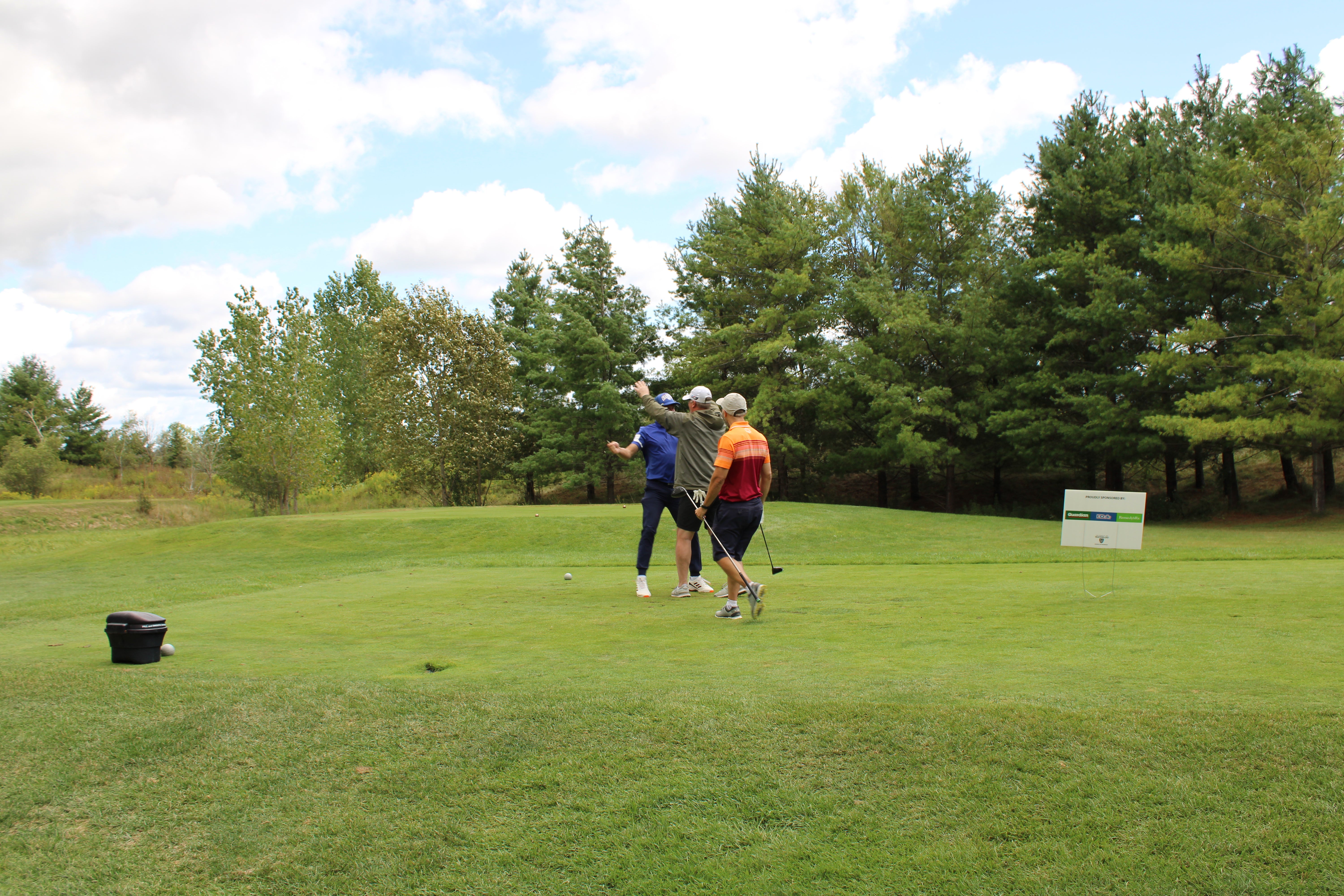People celebrating on the golf course