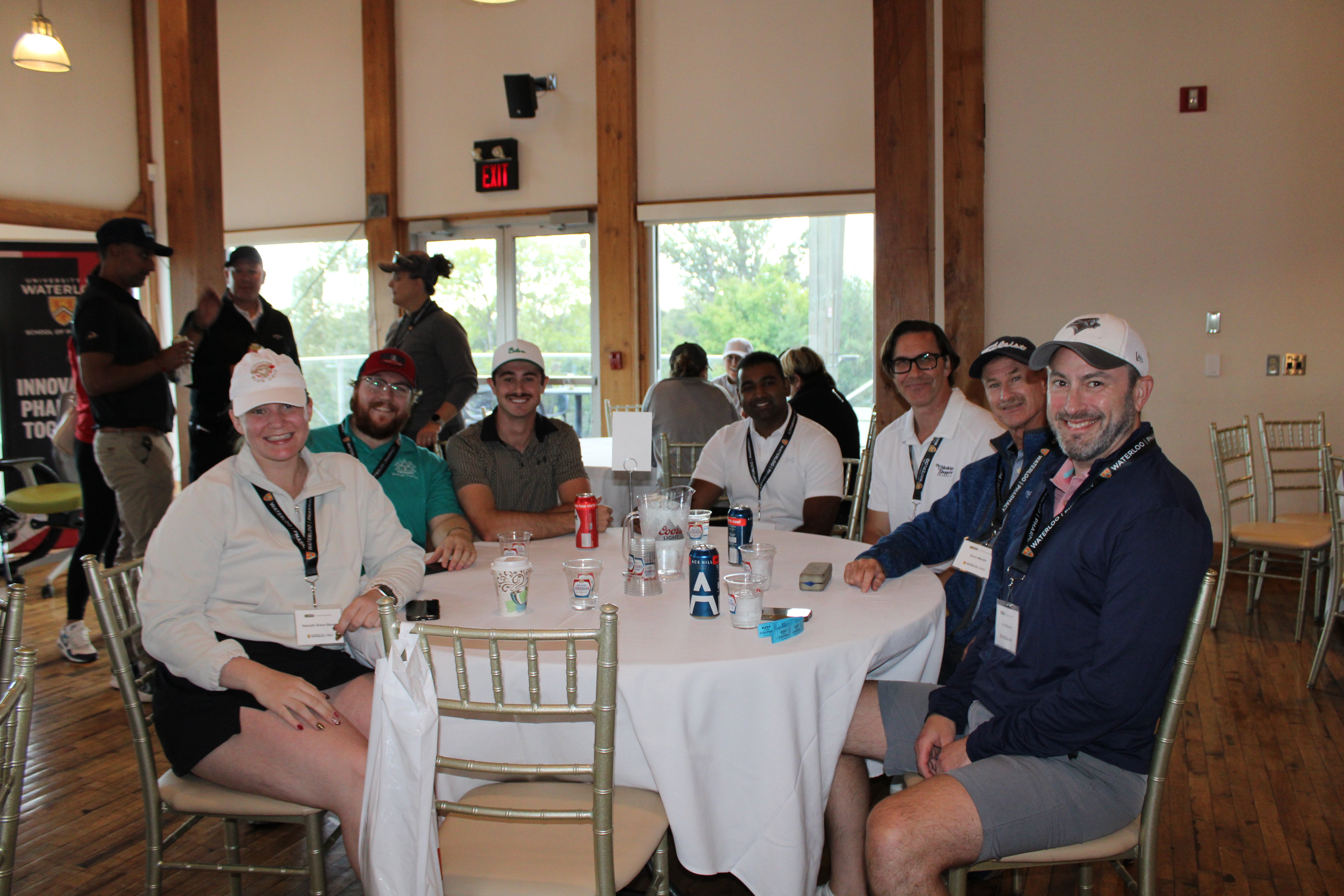 People sitting around a table smiling