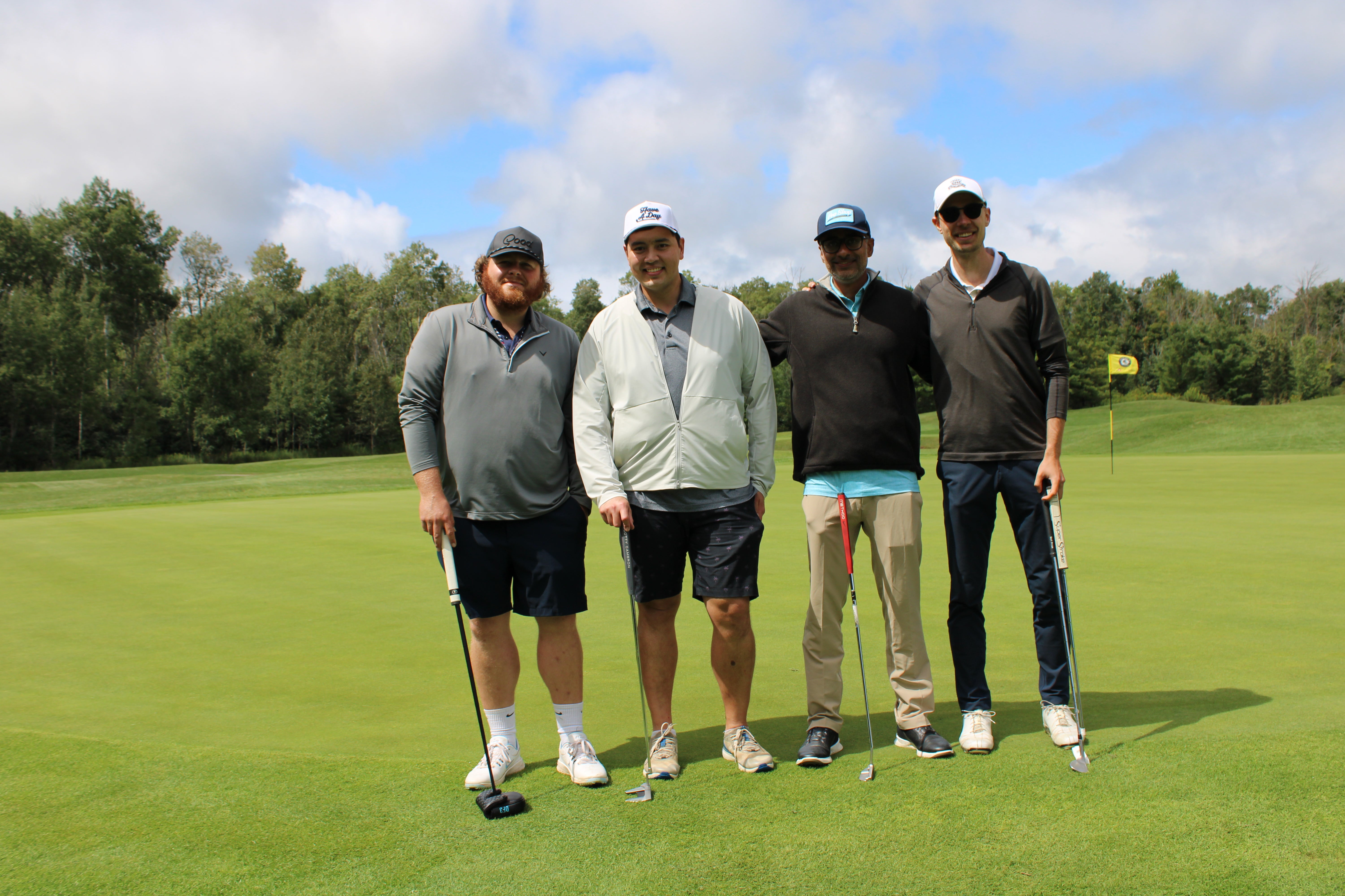 Golf foursome standing together