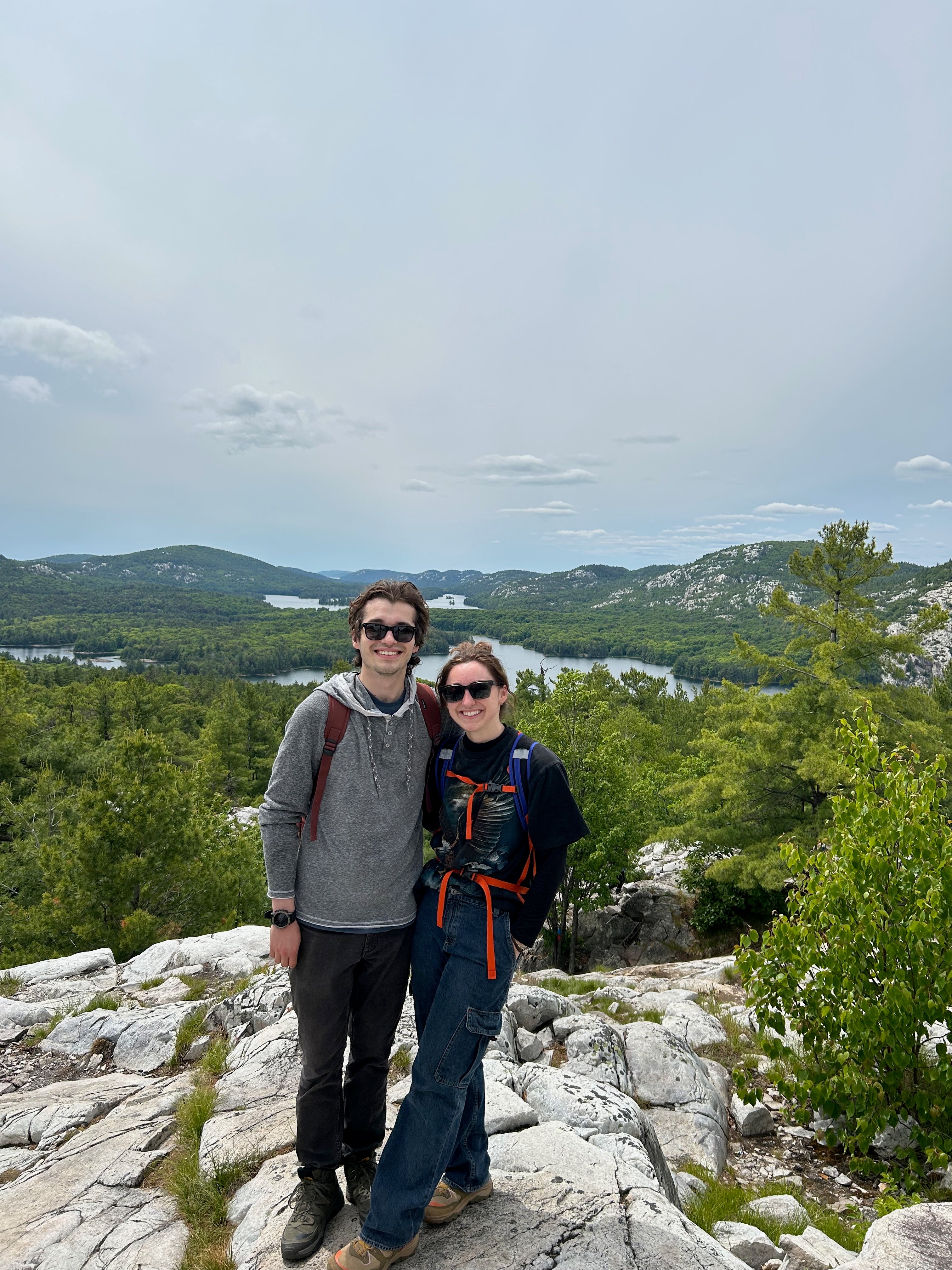 Matthew and Mackenzie smiling on a hike
