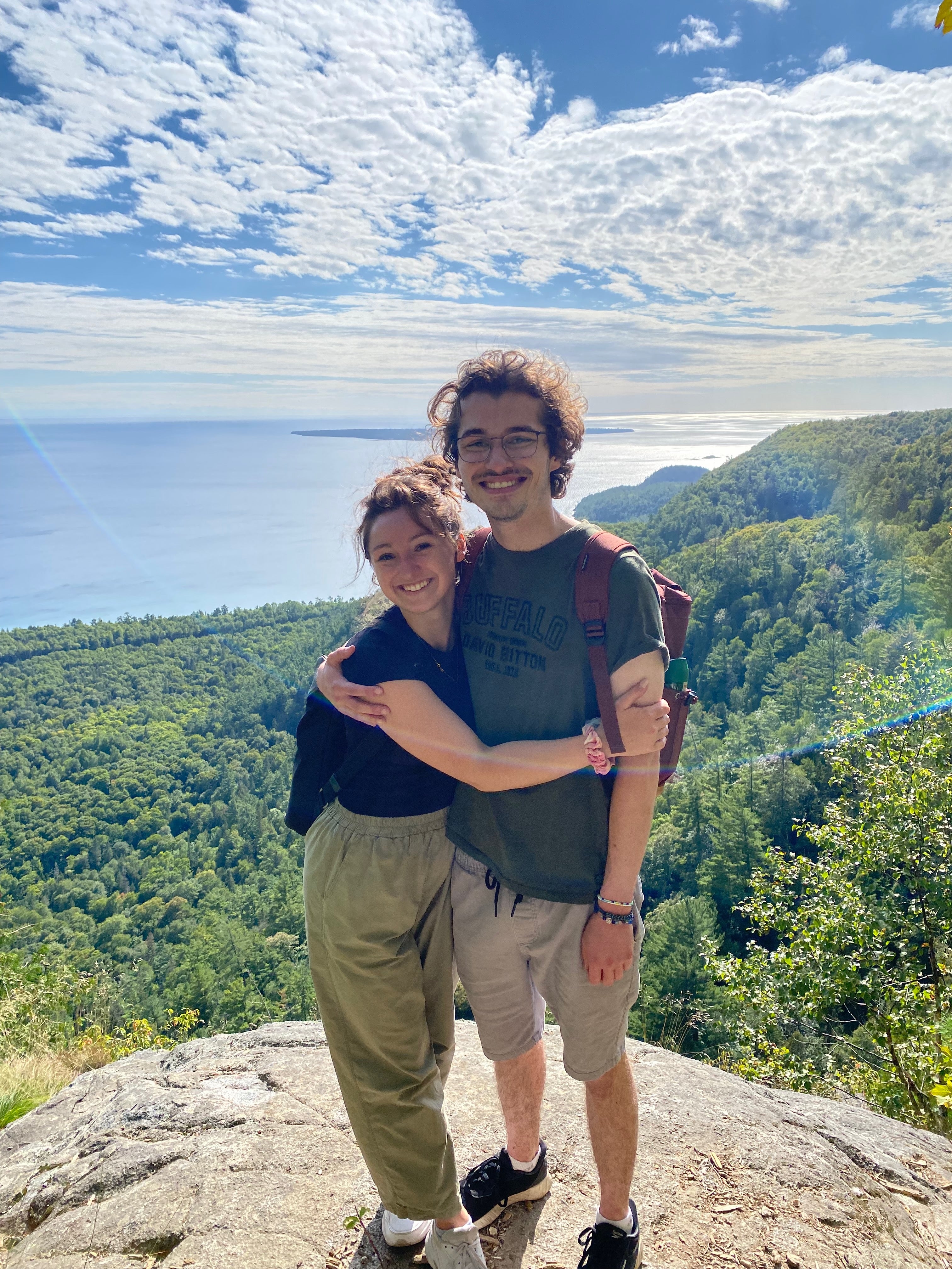 Mackenzie Gowlett and Matthew Miller smiling on a hike