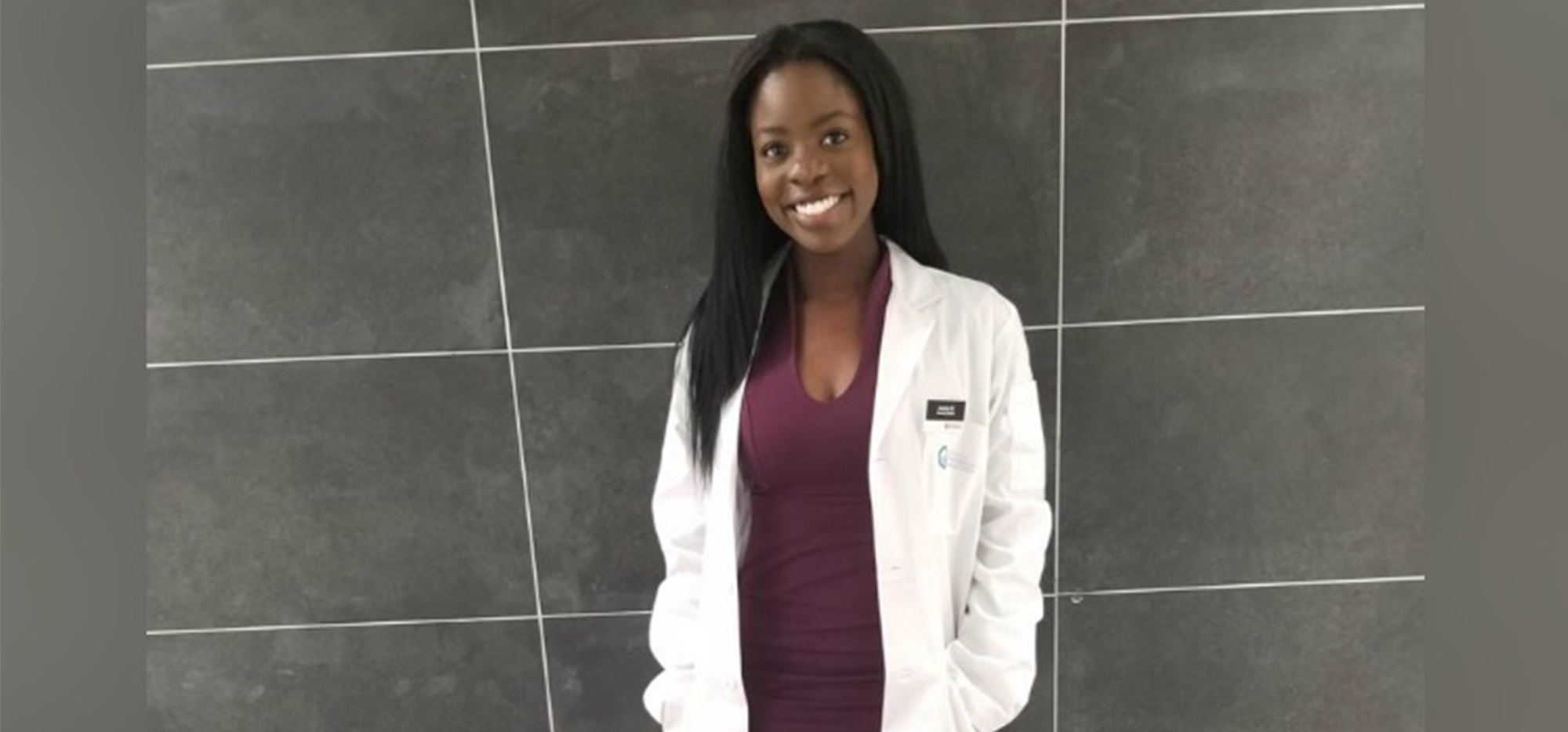 Jocelyn Bonti-Ankomah smiling and wearing a lab coat