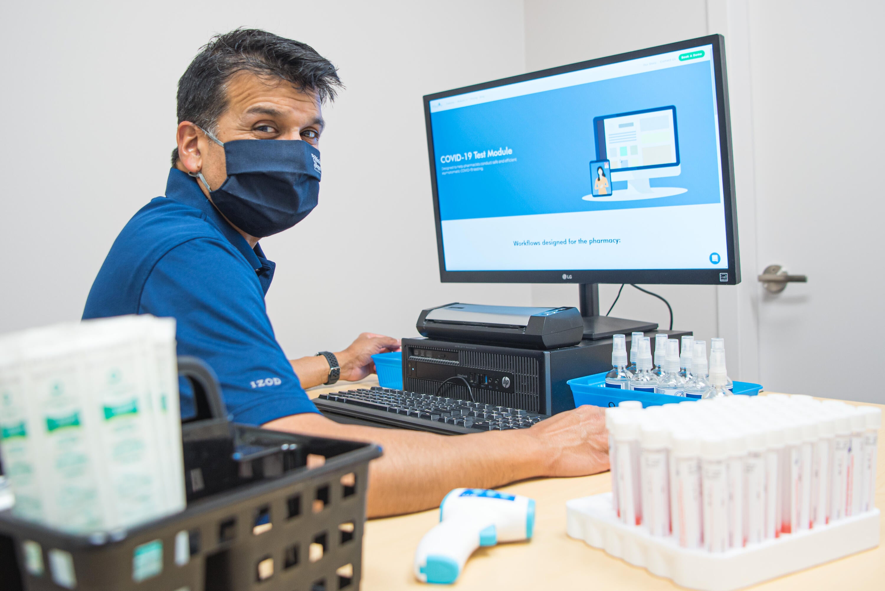 Suhas Thaleshvar, pharmacist and MedMe Health, at work using the MedMe system.